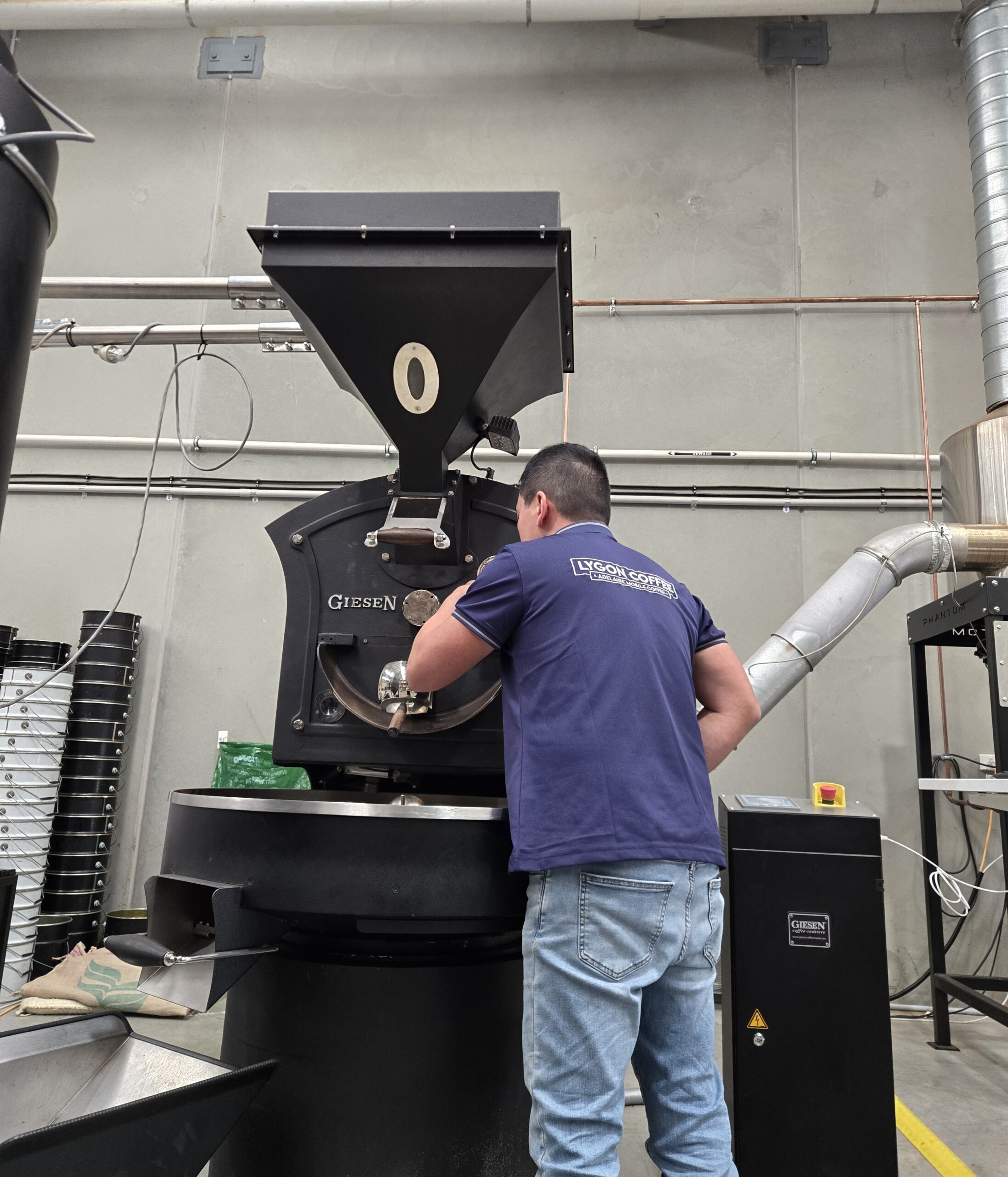 Lygon Coffee roaster at work beside the Giesen roasting machine